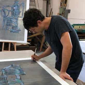 Wyatt Kahn signing an edition printed on lead in the Clinton studio on Bay Shore.