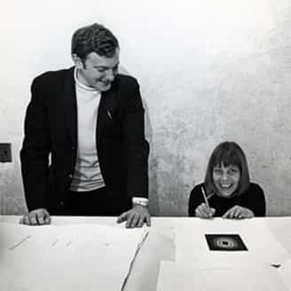 Tony Towle, poet and ULAE administrator, and Lee Bontecou signing their collaborative portfolio Fifth Stone, Sixth Stone. Photograph by Hans Namuth.