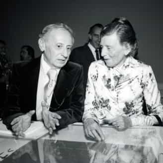 Tatyana Grosman and Dr. E. Maurice Bloch at the Words and Images opening at UCLA. The cover of Stones is in the case in the foreground. All the books and portfolios published by ULAE up to that time were exhibited.