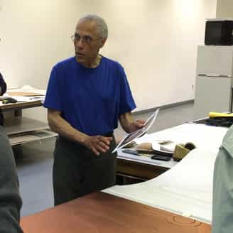 Martin Puryear working on editions in the studio and talking to a visiting tour group.