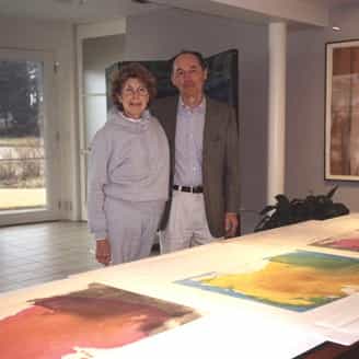 Helen Frankenthaler and Bill Goldston together at her home reviewing prints.
