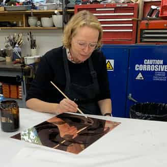Charline von Heyl working on an etching plate in the studio.