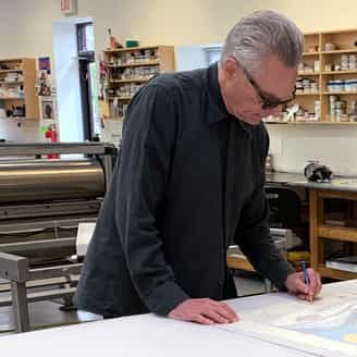 Carroll Dunham signing a new edition.