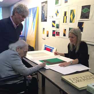 Carmen Herrera signing Verde y Negro at her home and studio with Tony Bechara and Larissa Goldston.