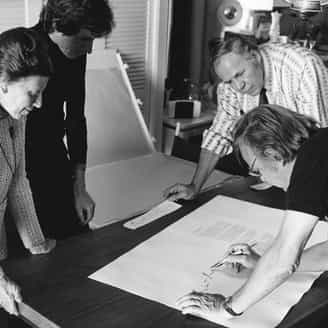 Robert Motherwell signing A La Pintura with Tatyana Grosman, printer Donn Steward and John McKendry (Curator of Prints & Photographs at the Metropolitan Museum of Art) looking on. 