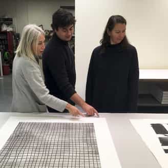 Larissa Goldston, Steven Fournier, and Sam Moyer in the studio signing new monoprints and an edition.